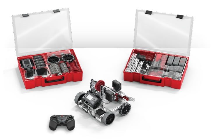 A VEX EXP kit in its red cases with an assembled metal robot and controller.